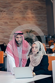 Arabic business couple working together on project at modern startup office