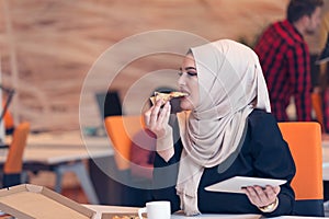 Arabic business woman wearing hijab,working in startup office.