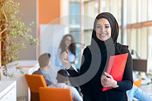 Arabic business woman working in team with her colleagues at office