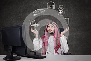 Arabic businessman thinking his dreams