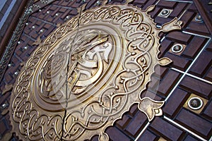 Arabic calligraphy depicting the Prophet Muhammad name written on the door of the mosque Nabawi in Medina, Saudi Arabia