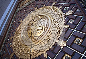 Arabic calligraphy depicting the Prophet Muhammad name written on the door of the mosque Nabawi in Medina, Saudi Arabia