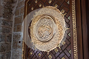 Arabic calligraphy depicting the Prophet Muhammad's name written on the door of the Mahmoudiya Mosque in Jaffa city