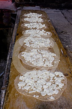 Arabic cuisine, cheese manakeesh in a bakery