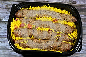 Arabic cuisine traditional food beef Kofta, kebab and tarb kofta shish which is minced meat with Basmati rice and raisins,