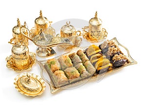 Arabic delight, tea cups golden lantern Iftar meal