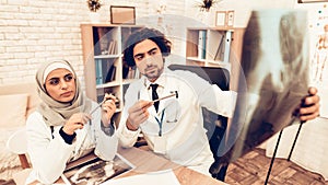 Arabic Doctors Having Consultation, X-Ray Film