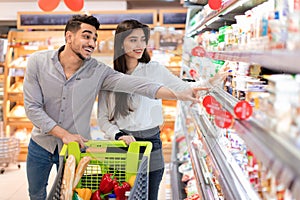 Arabic Family Couple Shopping Groceries Buying Food In Supermarket