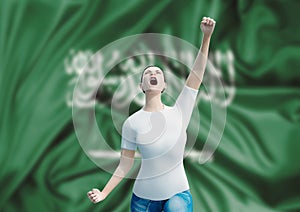 Arabic fan woman celebrating Saudi Arabia victory with flag. Arabic celebrating the independence of Saudi Arabia