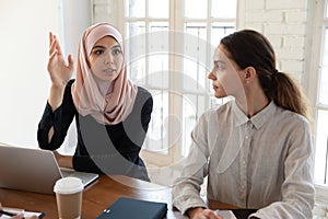 Arabic female employee participate in briefing in office