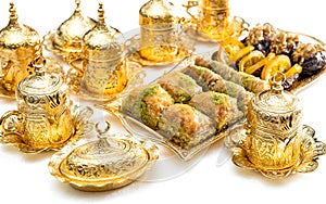 Arabic food delight tea cups golden decorations Oriental hospitality