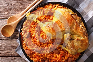 Arabic Food Kabsa: chicken with rice and vegetables close-up. ho