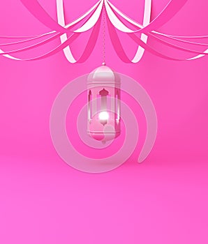 Arabic hanging lantern with ribbon on pink pastel background.