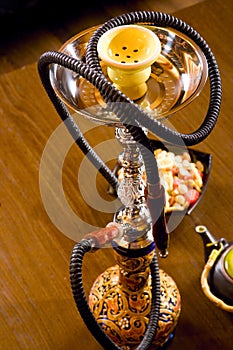Arabic hookah with woman's reflection