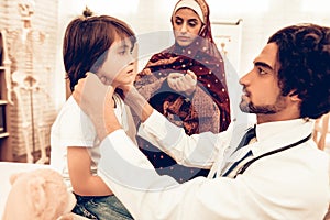 Arabic Male Doctor Examining a Little Boy. Child at the Pediatrician. Hospital Concept. Healthy Concept. Child Patient Visiting