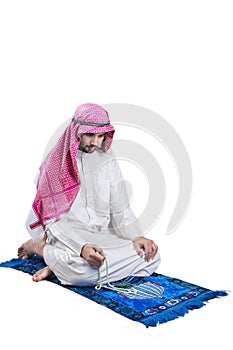 Arabic man dhikr on the carpet photo
