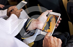 Arabic man looking at his phone