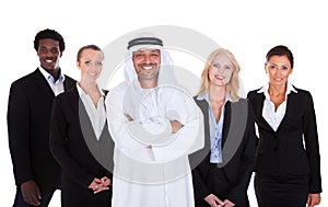 Arabic man standing with businesspeople