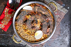 Arabic Meat Majboos with dal, daal, dhal, kentil and lemon served in dish isolated on red mat top view on table arabic food
