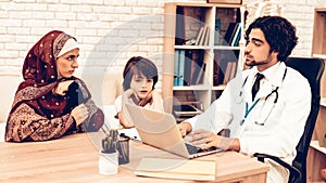 Arabic Mother with Son at Doctor`s Appointment