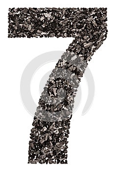 Arabic numeral 7, seven, from black a natural charcoal, isolated