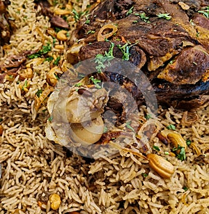 Arabic ouzi lamb rice.A kind of traditional arabian rice served with lamb shank. Stuffed lamb with rice