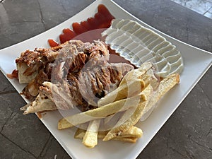 Arabic shawarma meal Chicken slices with mayonnaise and fried fries