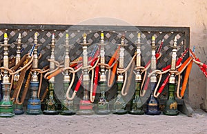 Arabic smoking pipes in a row