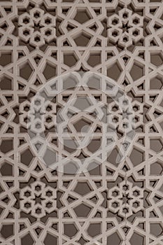 Arabic style carved stone arabesque openwork on a building facade in Old Dubai