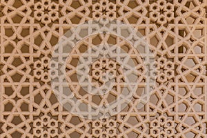 Arabic style carved stone openwork on a building facade in Old Dubai Deira.