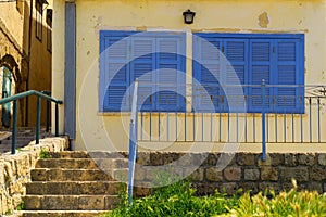 FaÃÂ§ade with Blue shutters and windows Acre Israel photo