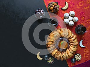 Arabic sweets. Arabian Qatayef and Egyptian cookies `Kahk El Eid`. Cookies of El Fitr Islamic Feast. Ramadan food background