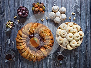 Arabic sweets. Arabian Qatayef, Ghorayeba sweets and Egyptian cookies `Kahk El Eid`. Cookies of El Fitr Islamic Feast.