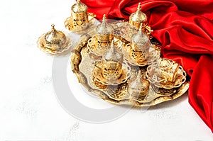 Arabic tea coffee service golden cups red decoration Hospitality concept