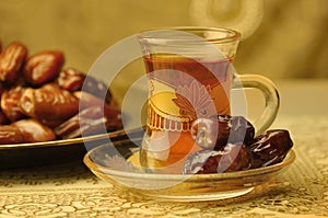 Arabic tea cup and dates