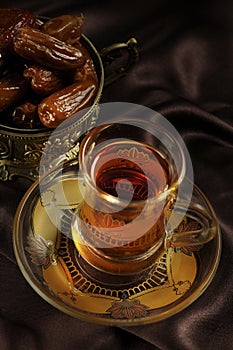 Arabic tea cup and dates