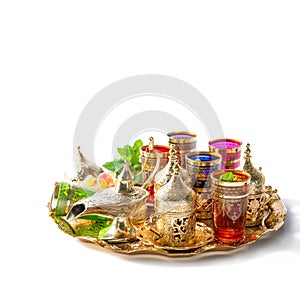 Arabic tea service golden cups Holidays decoration white background