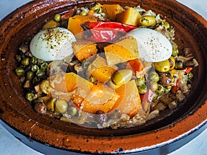 Arabic tajine with eggs and green olives in Morocco