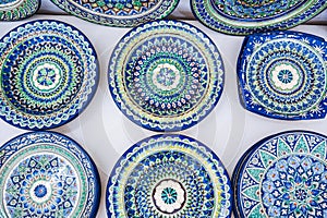 arabic Uzbek handmade ceramic plates with hand-painted traditional ethnic Asian patterns in tableware market in