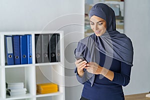 Arabic woman looking at phone