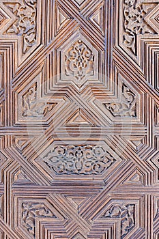 Arabic wooden decoration on the walls of the Nasrid Palace at the Alhambra in Spain