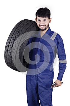 Arabic workshop worker with a tire