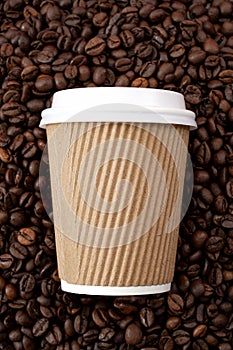 Arabica coffe aroma and takeout beverages concept with generic recyclable brown cardboard and paper cup with white plastic lid on