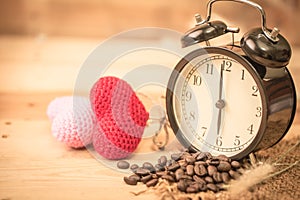 Arabica coffee bean with vintage clock