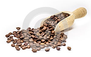 Arabica roasted coffee in brazilwood spoon, coffee seeds with copy space