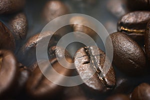 Different kinds of coffee beans. Coffee Background. Smoke roasted coffee beans photo