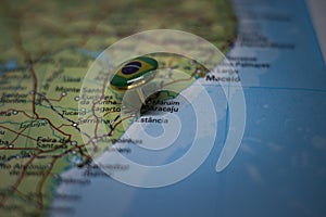 Aracaju pinned on a map with the flag of Brazil