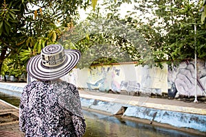 Senior woman tourist at the Macondo Linear Park in Aracataca the birthplace of Nobel Prize Gabriel Garcia Marquez photo