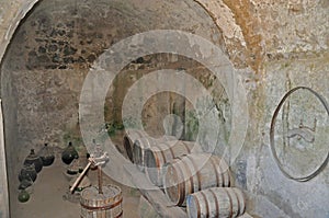 The Aragonese castle cellar with old barrels and bottles