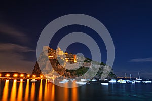 Aragonese castle at night. Bay of Naples, Ischia island, Italy